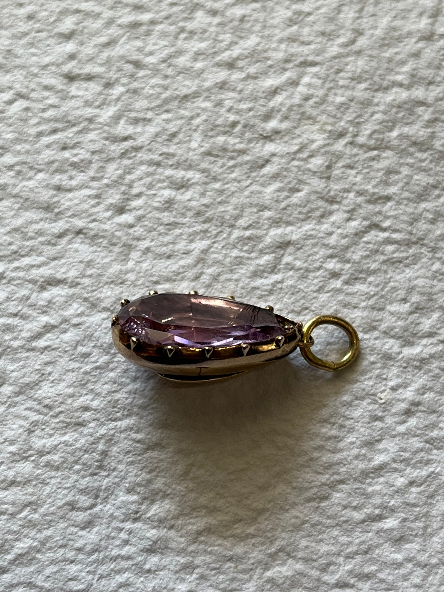 Chipped Georgian foiled-back amethyst teardrop pendant in cut down collet setting